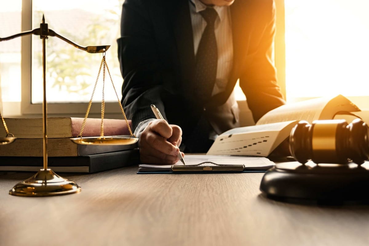 A lawyer working through case documents at a desk